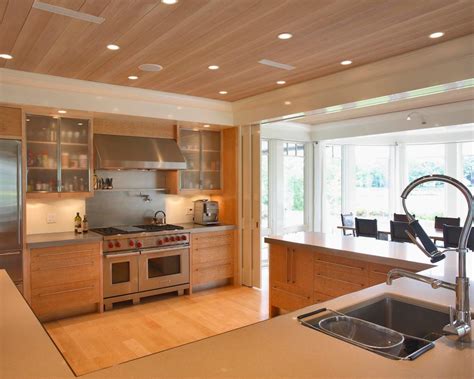 Get a ton of kitchen ceiling ideas here. Neutral Contemporary Kitchen With Wood Ceiling | HGTV