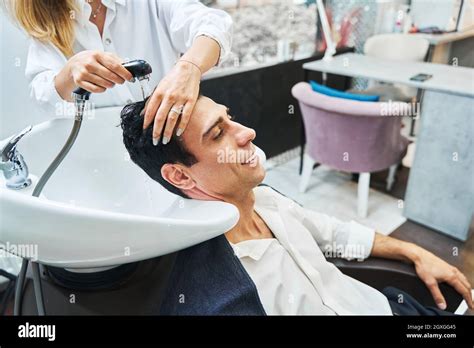 Client Enjoying Hair Washing In Beauty Salon Sink Stock Photo Alamy