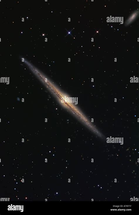 Ngc 4565 Is An Edge On Barred Spiral Galaxy In The Constellation Coma