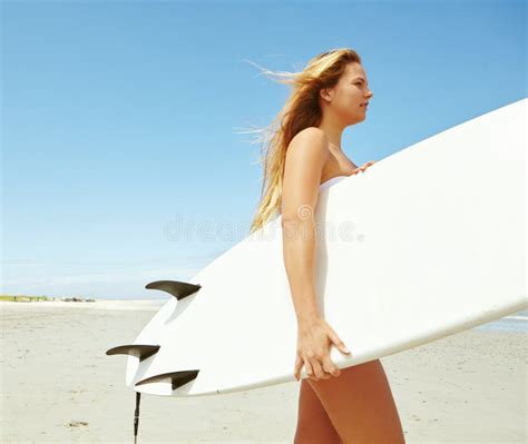 Surfing Beauty A Young Female Surfer Carrying Her Surfboard On The Beach Stock Image Image