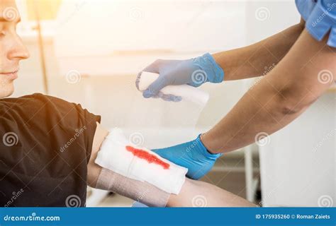 Nurse Dressing Wound For Patient`s Hand With Deep Skin Cutting Stock