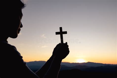 Silhouette Of Christian Woman Hand Praying Woman Holding A Crucifix
