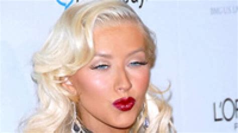 Christina Aguilera Flaunts Ample Cleavage At Her Clothing Line Launch