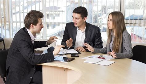 Group Of Three People Having Discussion Stock Photo Image 58432794