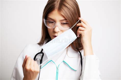 Medicine Concept Doctor Puts On Protective Surgical Mask For