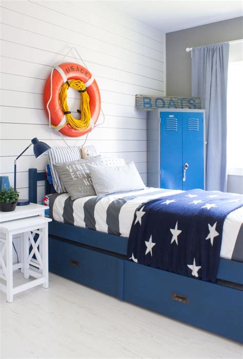 This bedroom features industrial decor, including silver dresser drawers and gold lamps. Nautical Boy Room - The Lilypad Cottage