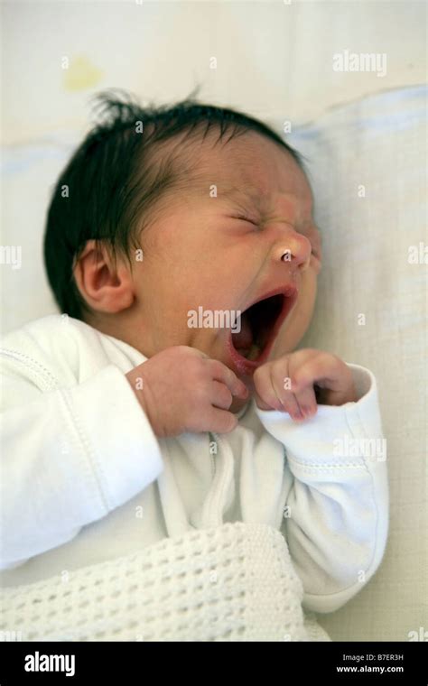 A Newborn Baby Yawning Stock Photo Alamy