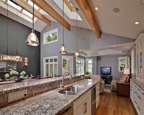 The large kitchen island with seating has an under mount sink and an end breakfast bar dining area. Contemporary decoration for vaulted ceiling kitchen ...