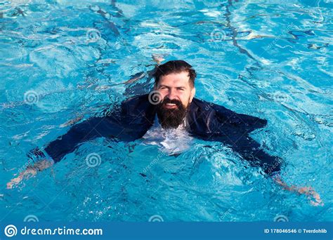 Businessman Swimming In Suit In The Pool Funny And Crazy Man In