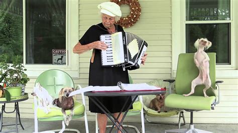 Grandma Playing Accordion With Her Dancing Dogs