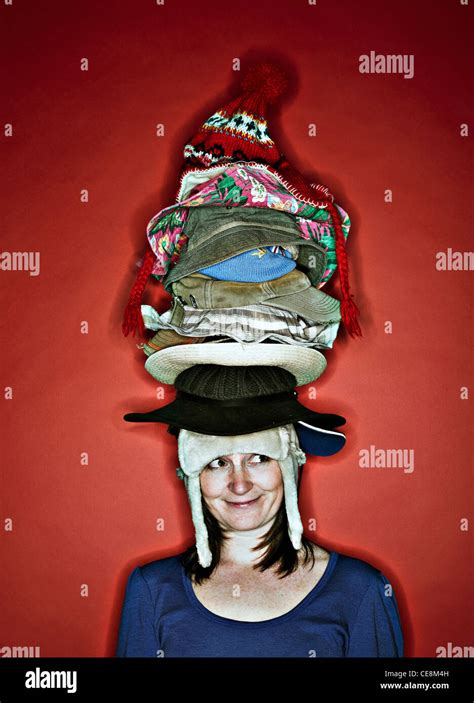 Woman Wearing Many Hats Stock Photo Alamy