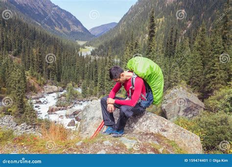 Sad Man Sitting On A Stone In The Mountains Stock Image Image Of