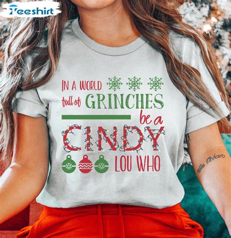 In A World Full Of Grinches Be A Cindy Lou Shirt Christmas Sweater Hoodie