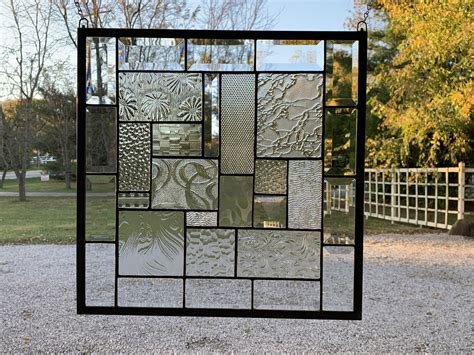 Stained glass window panel metropolis gorgeous multicolor stained glass window panel with abstract pattern comprised of rectangles, squares, ovals and curves. Stained Glass Panel, 17 X 17, Clear Textured Glass ...