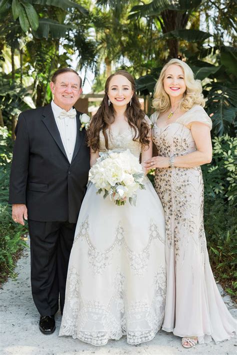 Bride, Parents in Wedding Attire