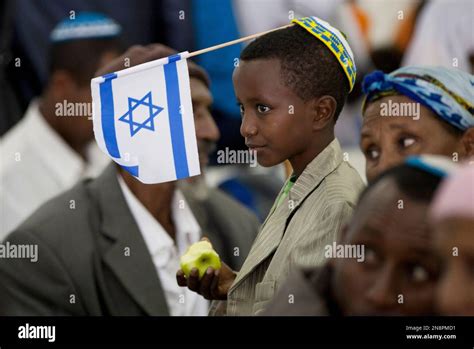 A Newly Immigrated Ethiopian Jewish Boy With An Israeli Attends A