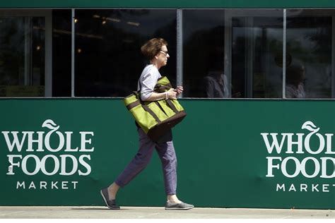 You'll work inside a whole foods market getting grocery orders ready for delivery (going grocery shopping for prime members). A shopper leaves a Whole Foods Market in Northbrook, Ill ...