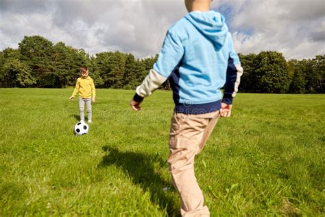 Happy Little Boys With Ball Playing Soccer At Park Stock Photo Image