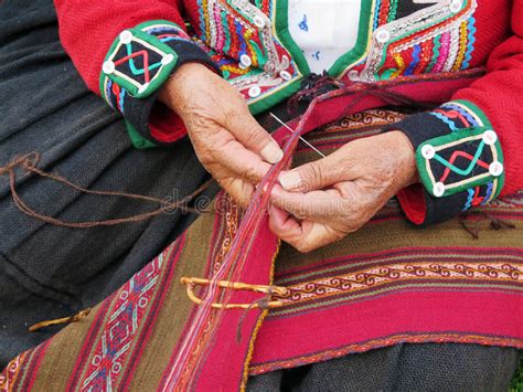 Close Up Of Peruvian Lady In Authentic Dress Spinning Yarn By Ha Stock