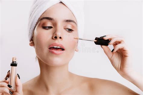 Girl After Shower Put Concealer Under Eyes Portrait Of Beautiful Woman On White Background