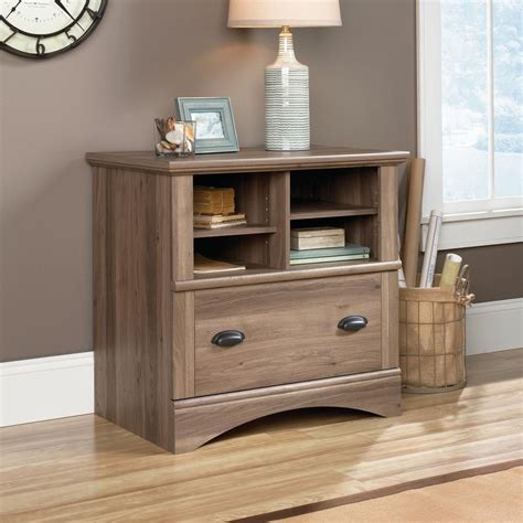 A filing cabinet (or sometimes file cabinet in american english) is a piece of office furniture usually used to store paper documents in file folders. SAUDER Harbor View Salt Oak Lateral File Cabinet with 1 ...