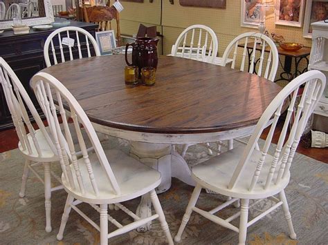 Enrich the elegance of your dining area with this dining table that features a wood texture tabletop and a pedestal. Pin on For the Home