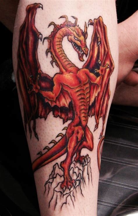 Black ink dragon tattoo on man left forearm. Awesome gespierd red dragon tattoo on forearm ...