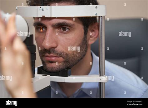 Man Having Eye Examination Using Slit Lamp Stock Photo Alamy