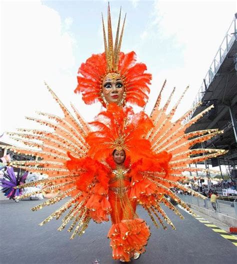 A Masquerader Displays Her Costume At The Annual Trinidad And Tobago Red Cross Society