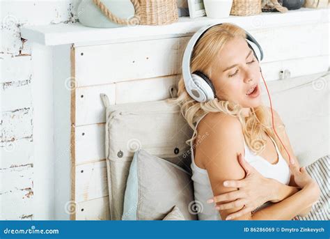 Amazed Woman Listening To Music In Bed Stock Image Image Of Beauty