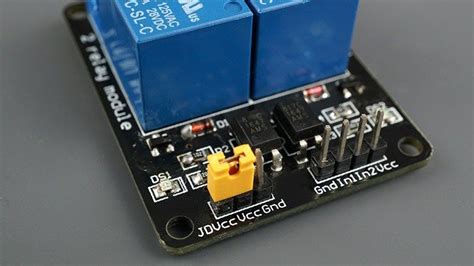 An Electronic Device With Two Blue Switches On Its Back Side And One