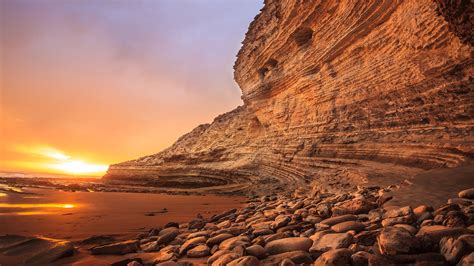 Rock Formation Near The Body Of Water Photo Coast Sunset Hd Wallpaper