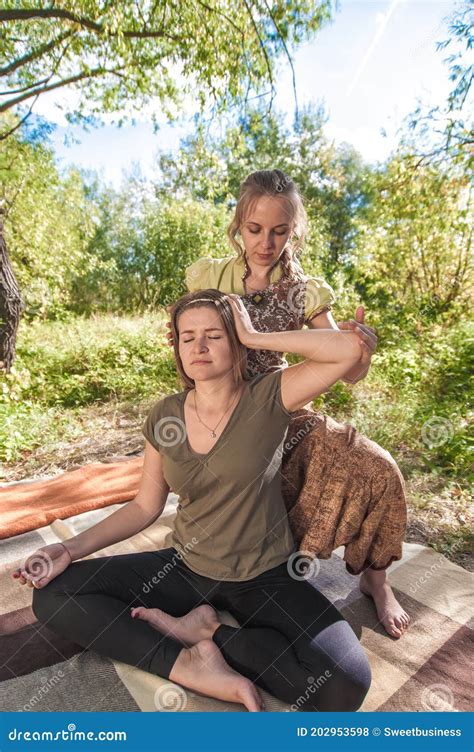 Girl On Massage In Nature With Massage Therapist Stock Photo Image