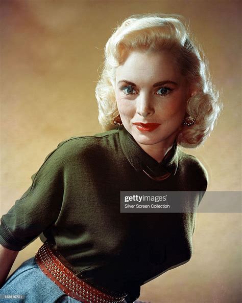 American Actress Janet Leigh In A Green Short Sleeved Top And Red