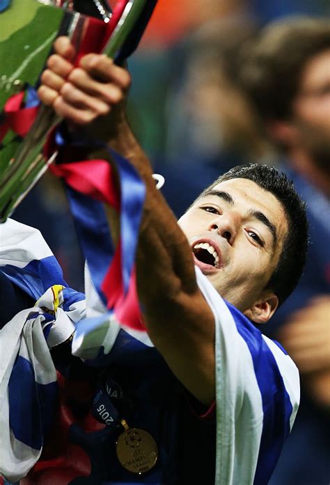 First team presentation for the coming 2019 2020 season. BERLIN, GERMANY - JUNE 06: Luis Suarez of Barcelona lifts ...