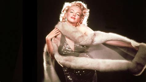 marilyn monroe s nude red velvet photo signed by hugh hefner to be auctioned fox news