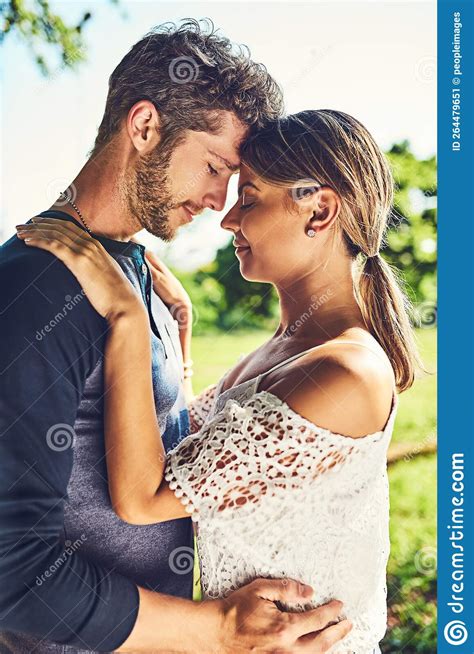 Hold Me Close A Young Couple Bonding Together Outdoors Stock Image Image Of Casual
