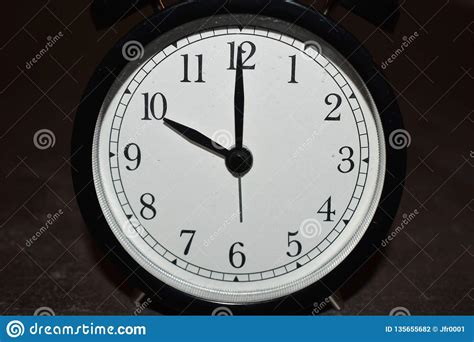 Clock Pointing To Different Times Stock Photo Image Of Close White