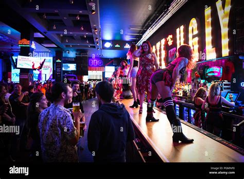 Inside A Coyote Ugly Bar Where Women Dance On The Bar As People Order