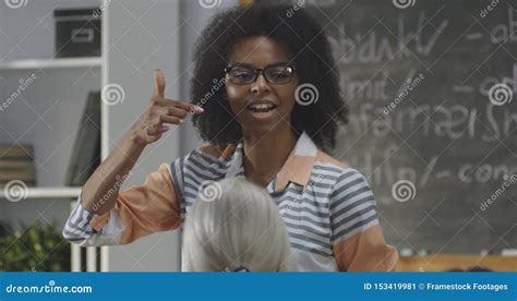 Young Teacher Explaining To A Class Stock Image Image Of Class