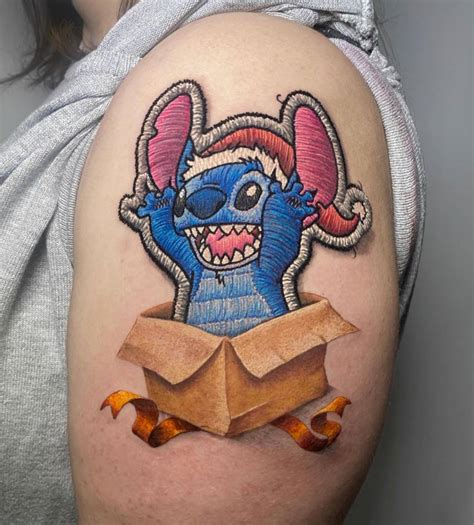 Stitch Tattoo Located On The Upper Arm Embroidery