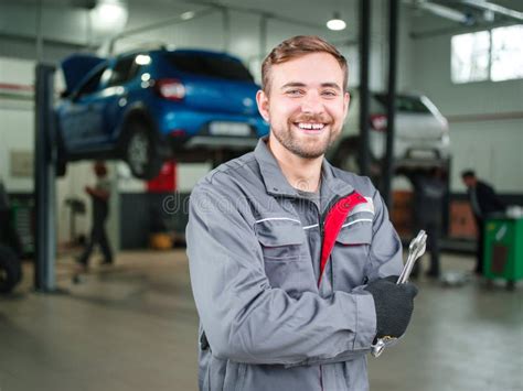 Young Mechanic In The Auto Repair Shop Thumbs Up Stock Image Image