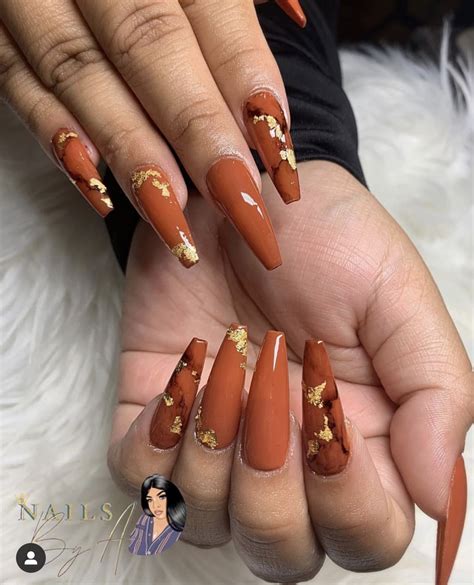It's most flattering to darker skin tones—cinnamon, honey, warm brown, mahogany—and extraordinarily pale skin. Burnt orange fall colors🔥🔥 | Fall acrylic nails, Orange nails, Coffin nails designs