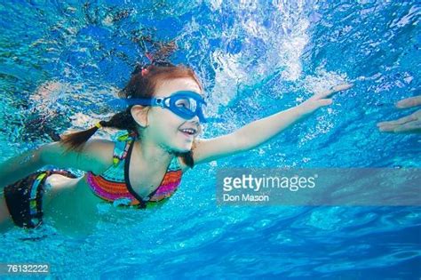 Underwater Shot Of Asian Girl Swimming Photo Getty Images