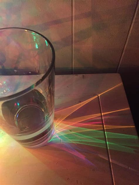 My Christmas Lights Refracting Through My Glass Of Water Reflection And
