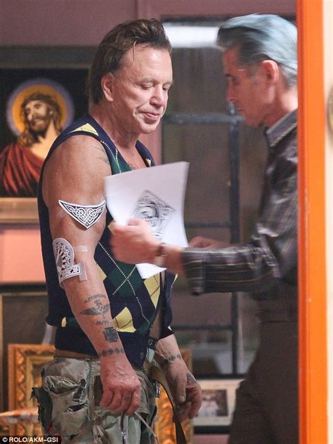 Mickey Rourke Whips Off His Shirt To Get Another Tattoo Daily Mail Online