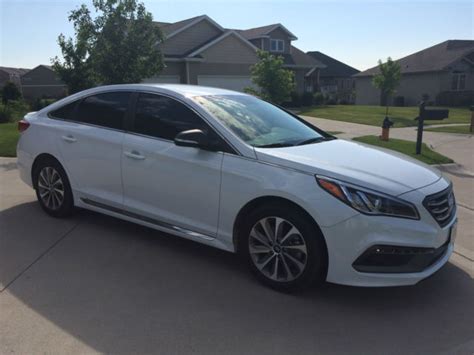 You say you don't want to drain your bank account, but still want some value and refinement? 2015 Hyundai Sonata Sport Sedan 4-Door 2.4L Quartz White Pearl