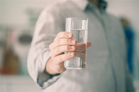 Male Holding Glass Of Water Stock Photo Download Image Now Istock