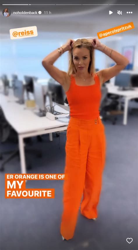 Amanda Holden Removes Her Bra And Wears A Low Cut Orange Top In A