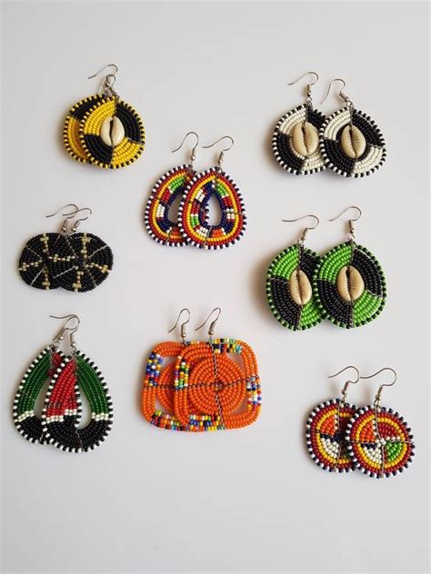Six Pairs Of African Beaded Earrings In Various Colors And Shapes On A